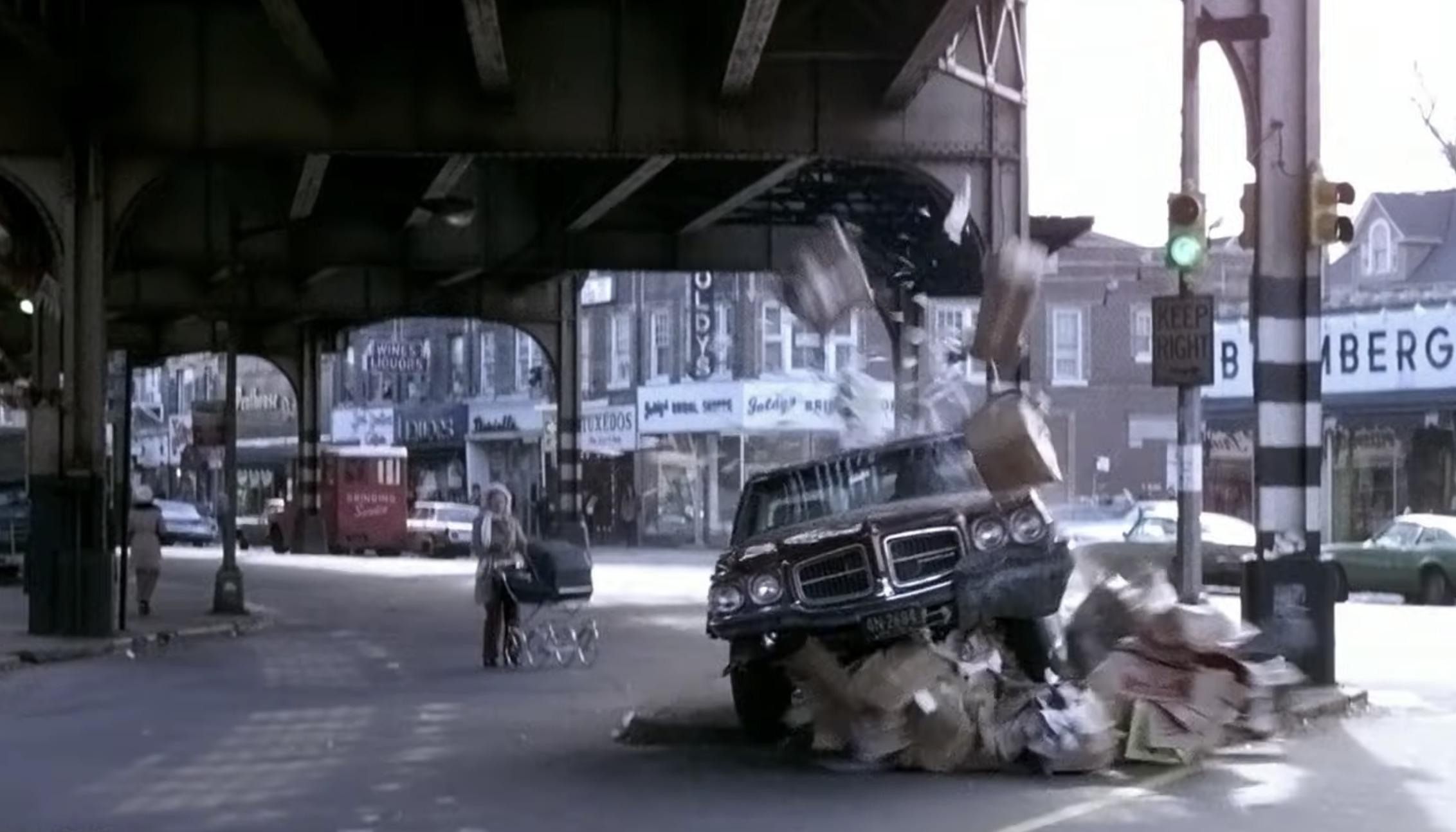 A 1971 Pontiac LeMans racing through Brooklyn streets in The French Connection, bumper camera perspective