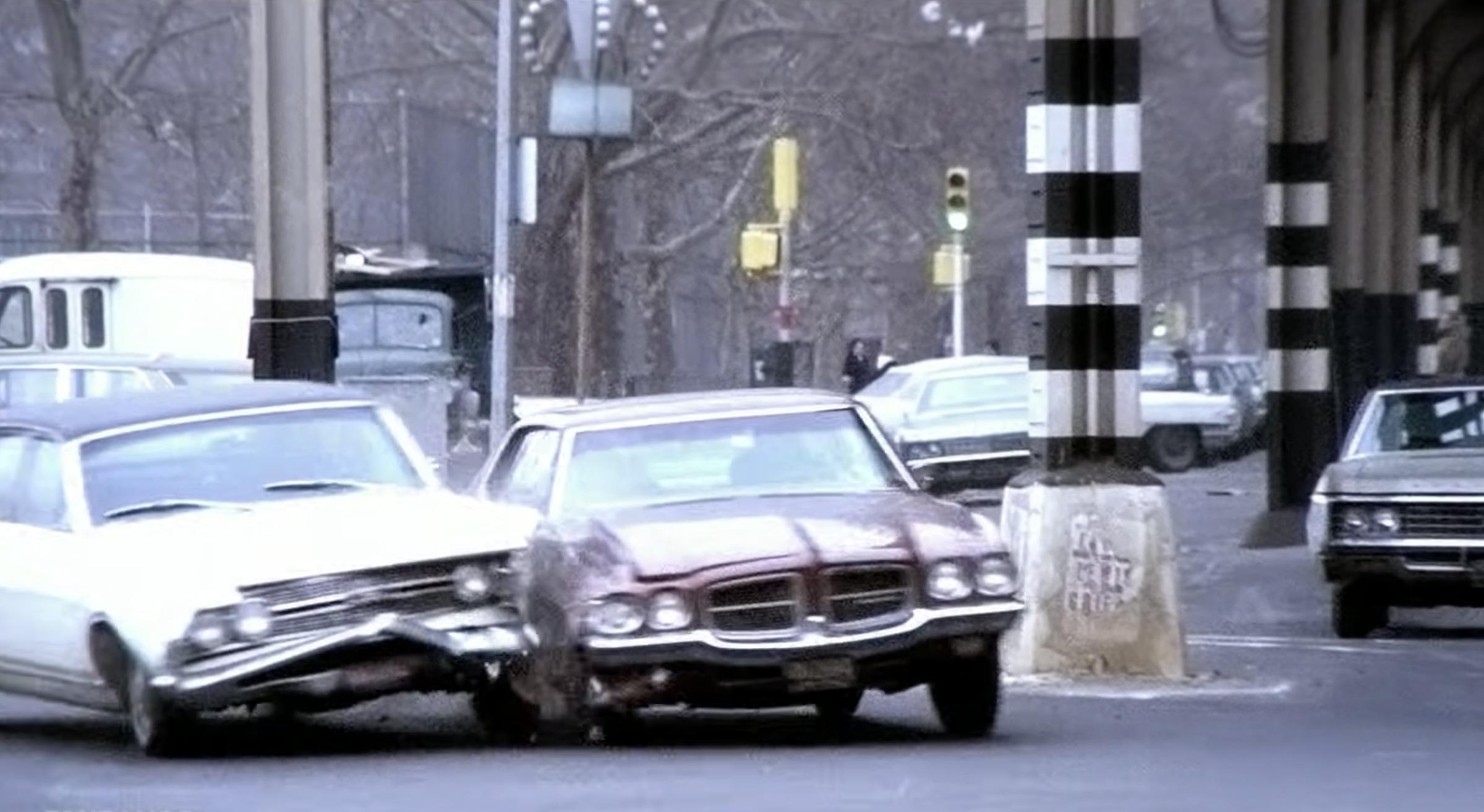 Wide shot of the Pontiac LeMans during the French Connection chase through Brooklyn streets